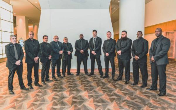 10 security guards in suits